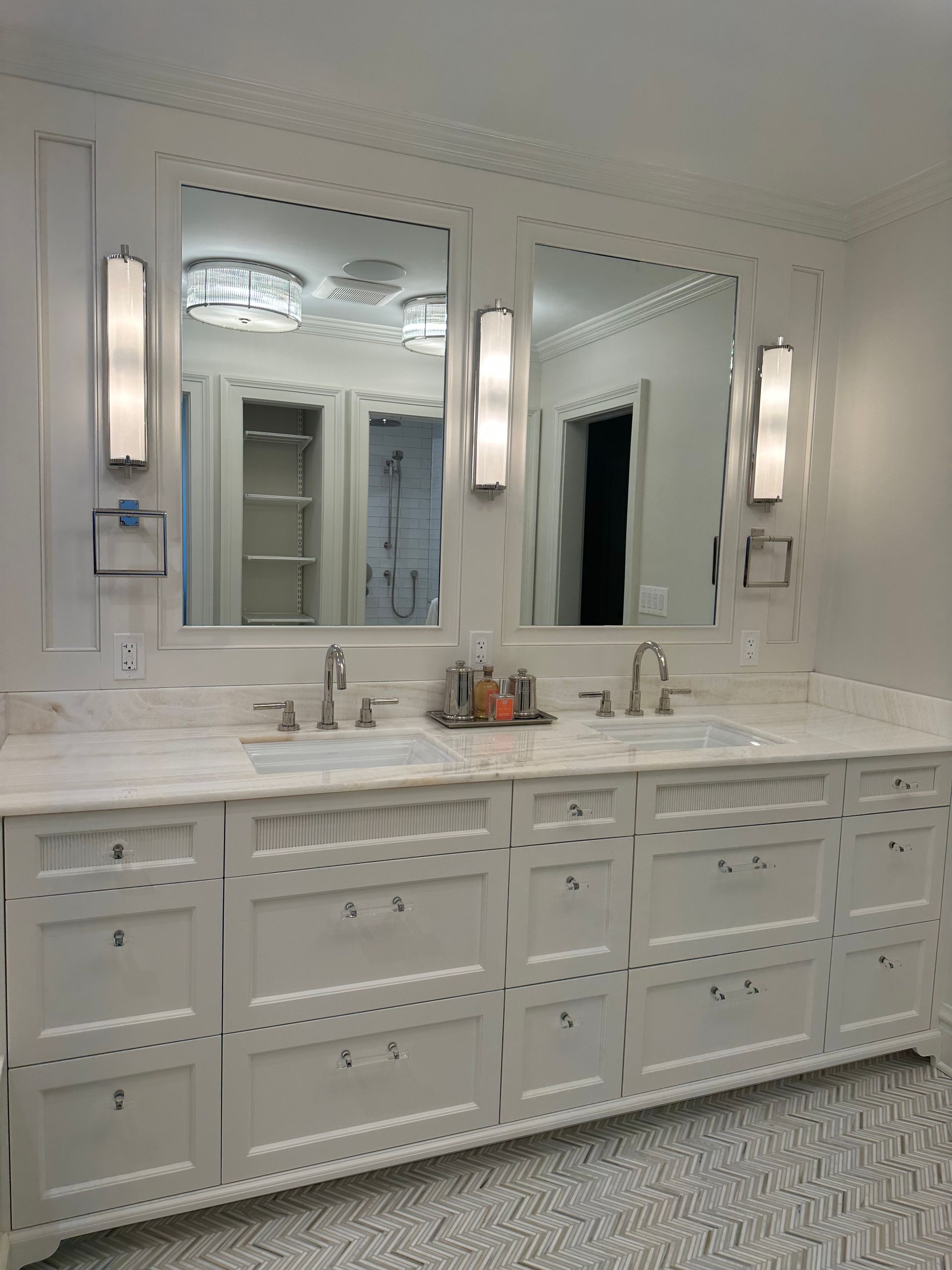 A bathroom with two sinks and two mirrors.