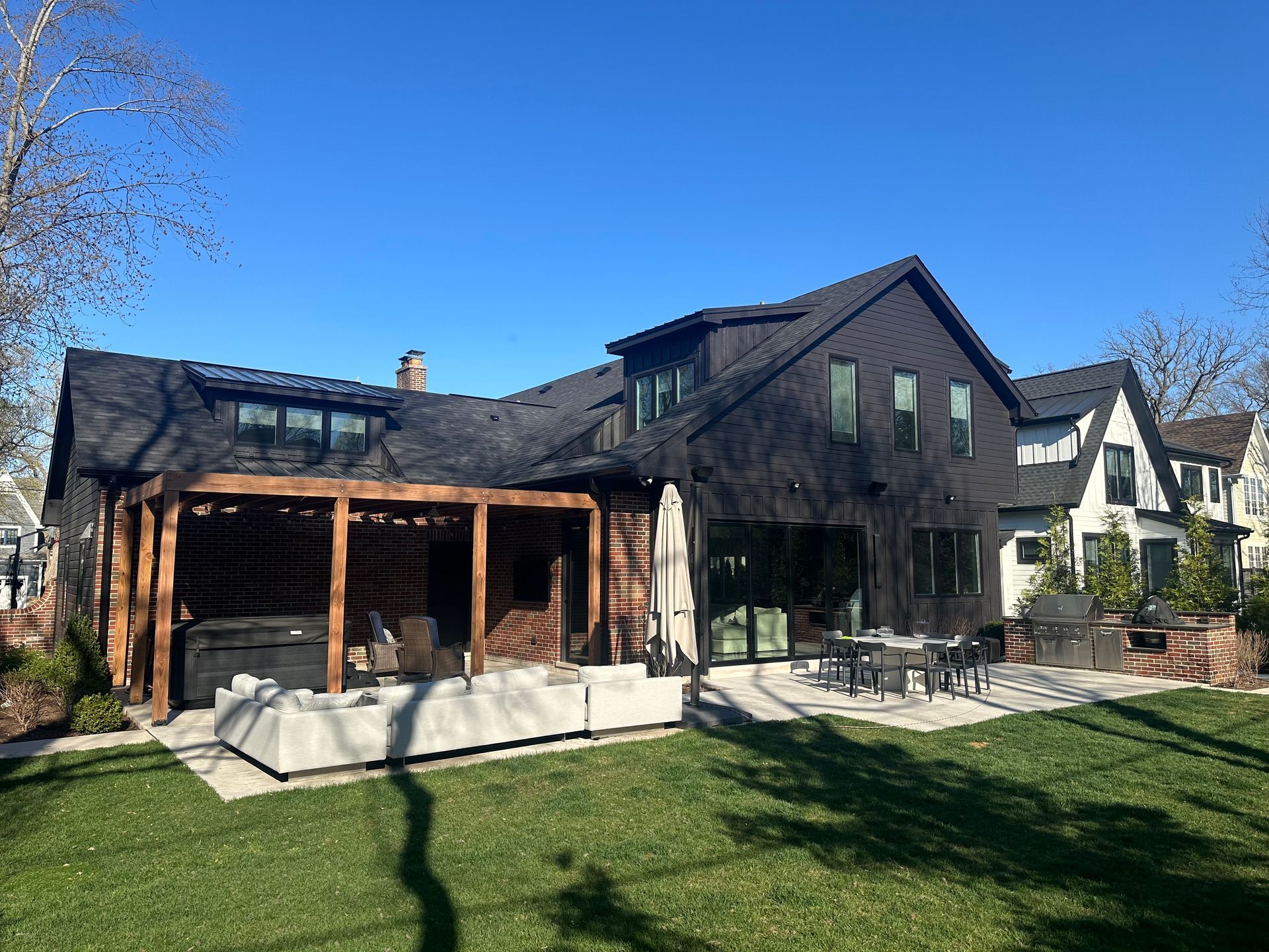 A large house with a large lawn in front of it.