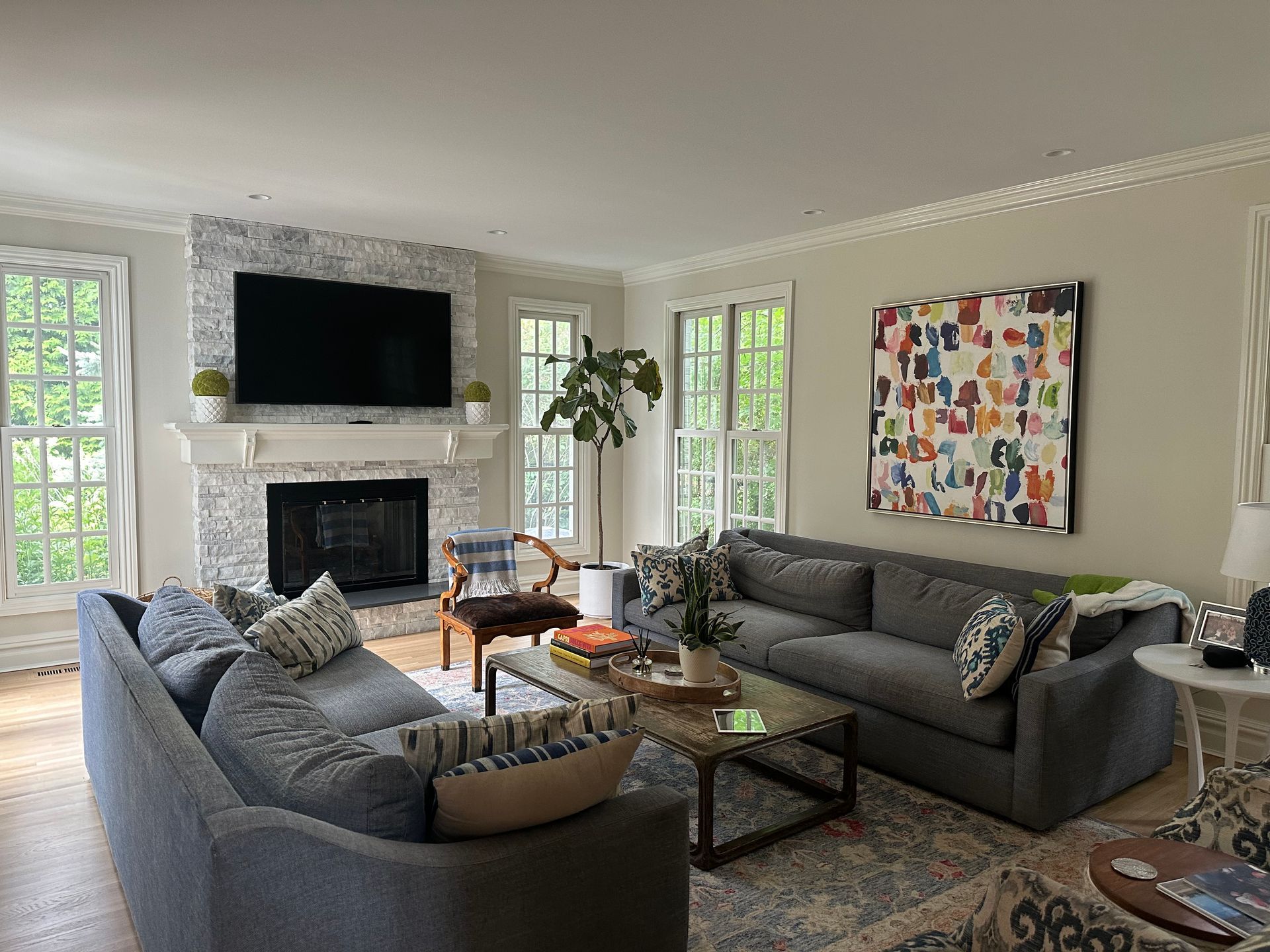 A living room filled with furniture and a fireplace.