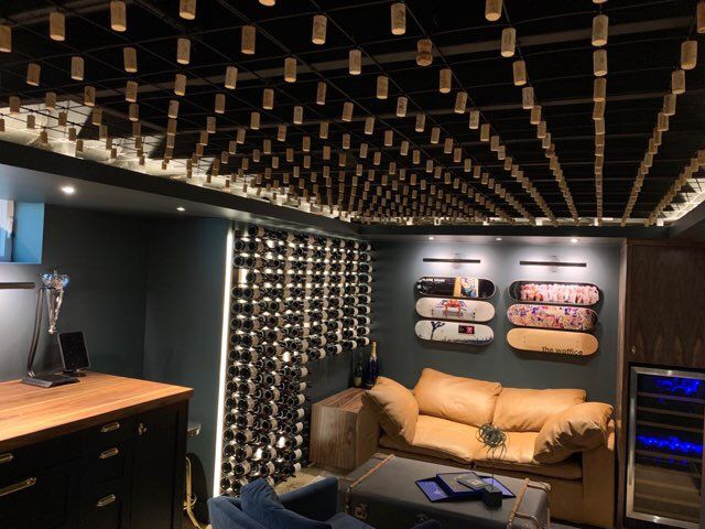 A living room with a couch and skateboards on the wall