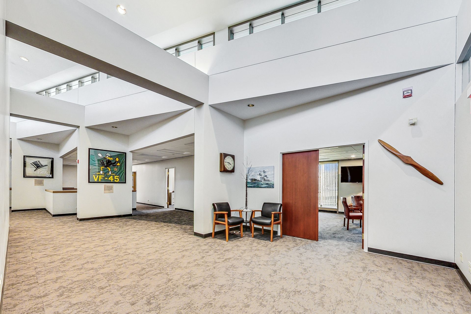 There is a clock on the wall in the middle of the room.