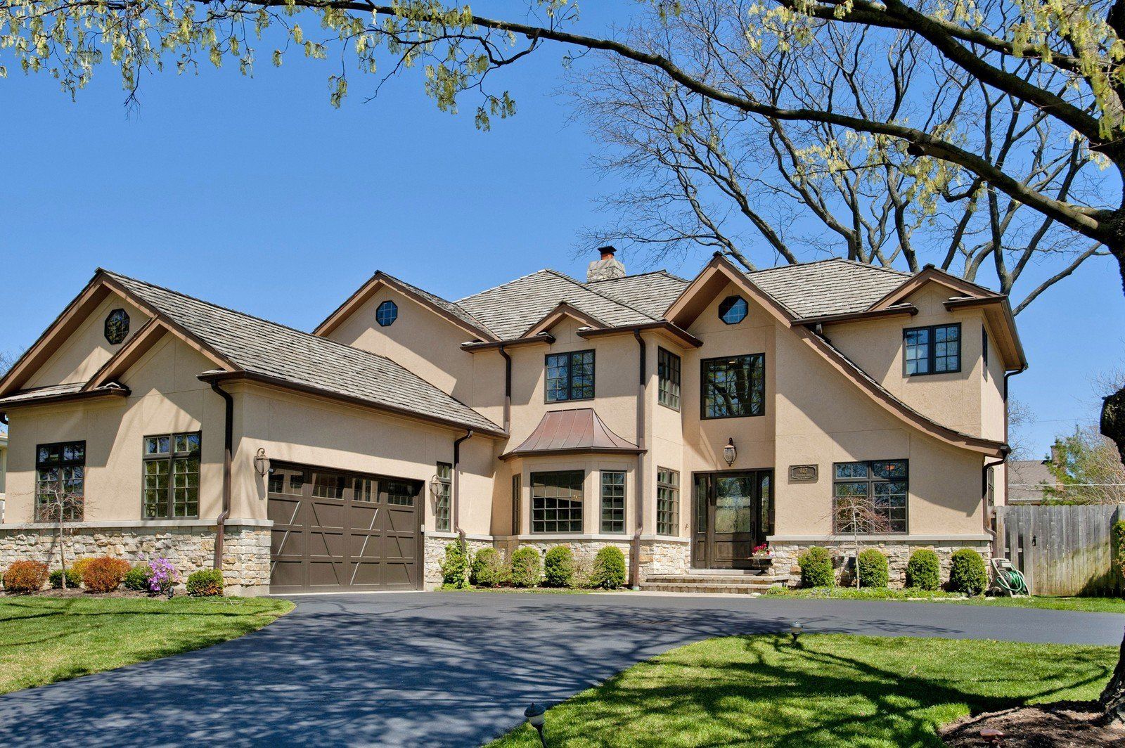 A large house with a driveway in front of it