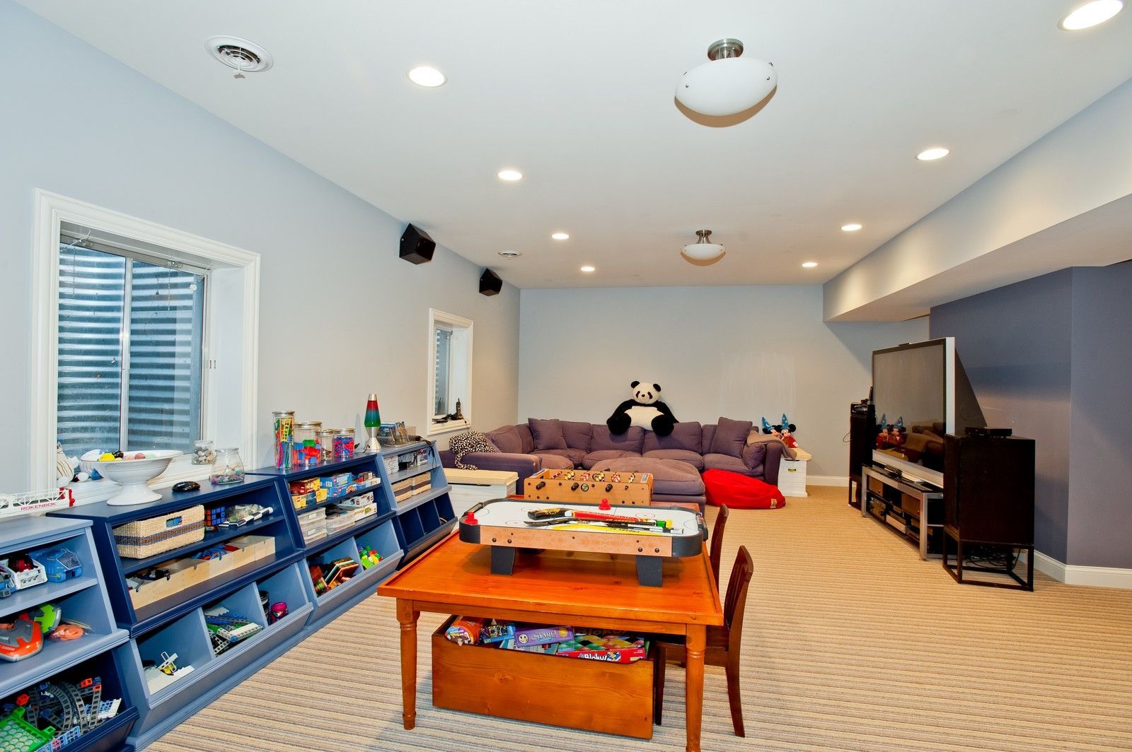 A play room with a table and chairs and a couch
