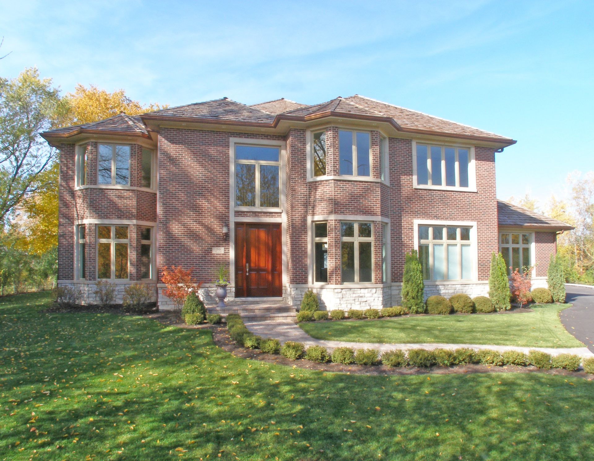 A large brick house with a lot of windows