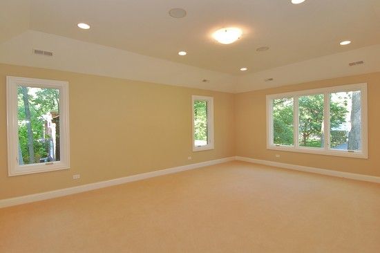 A large empty room with a lot of windows