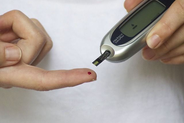 A person with diabetes tests their blood sugar levels.