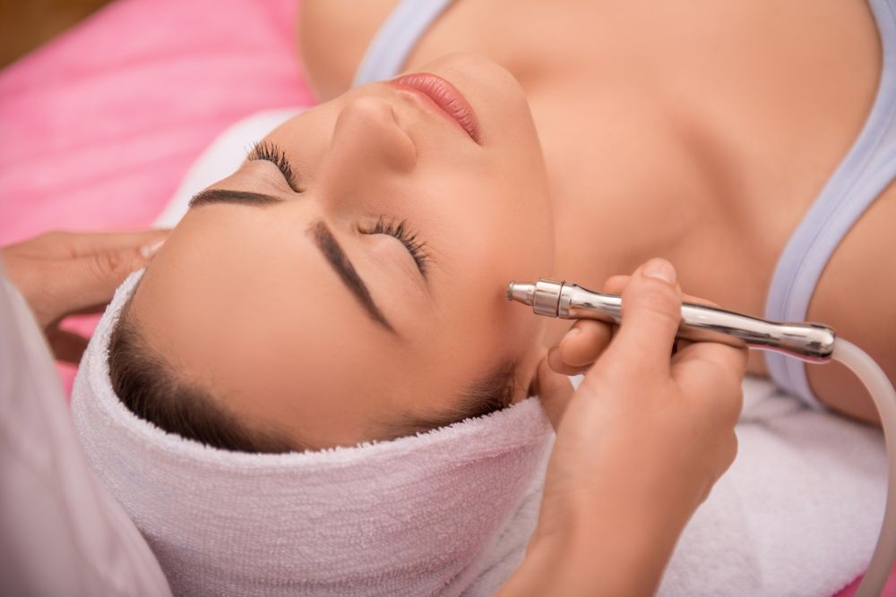 A girl receiving laser skin treatment.