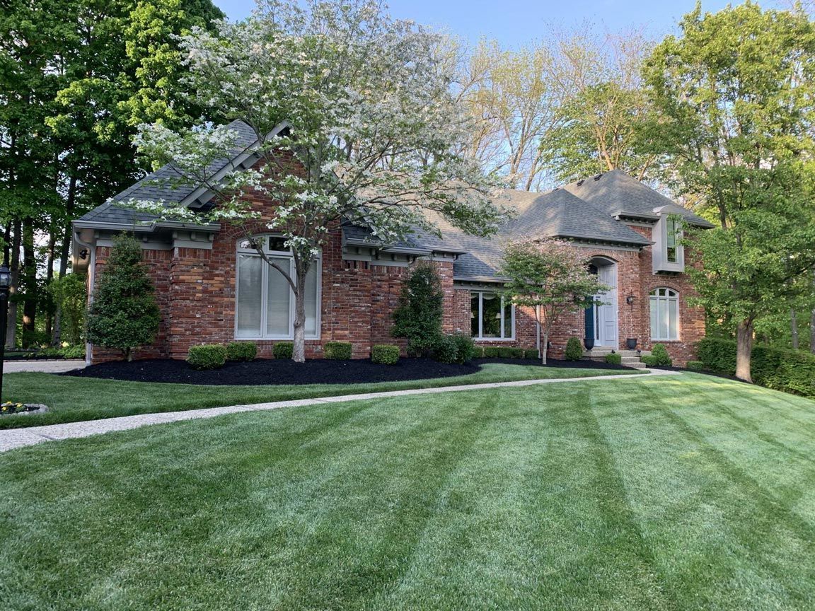 Large Brick House Lush Green Lawn — Louisville, KY — Titan Landscape Group