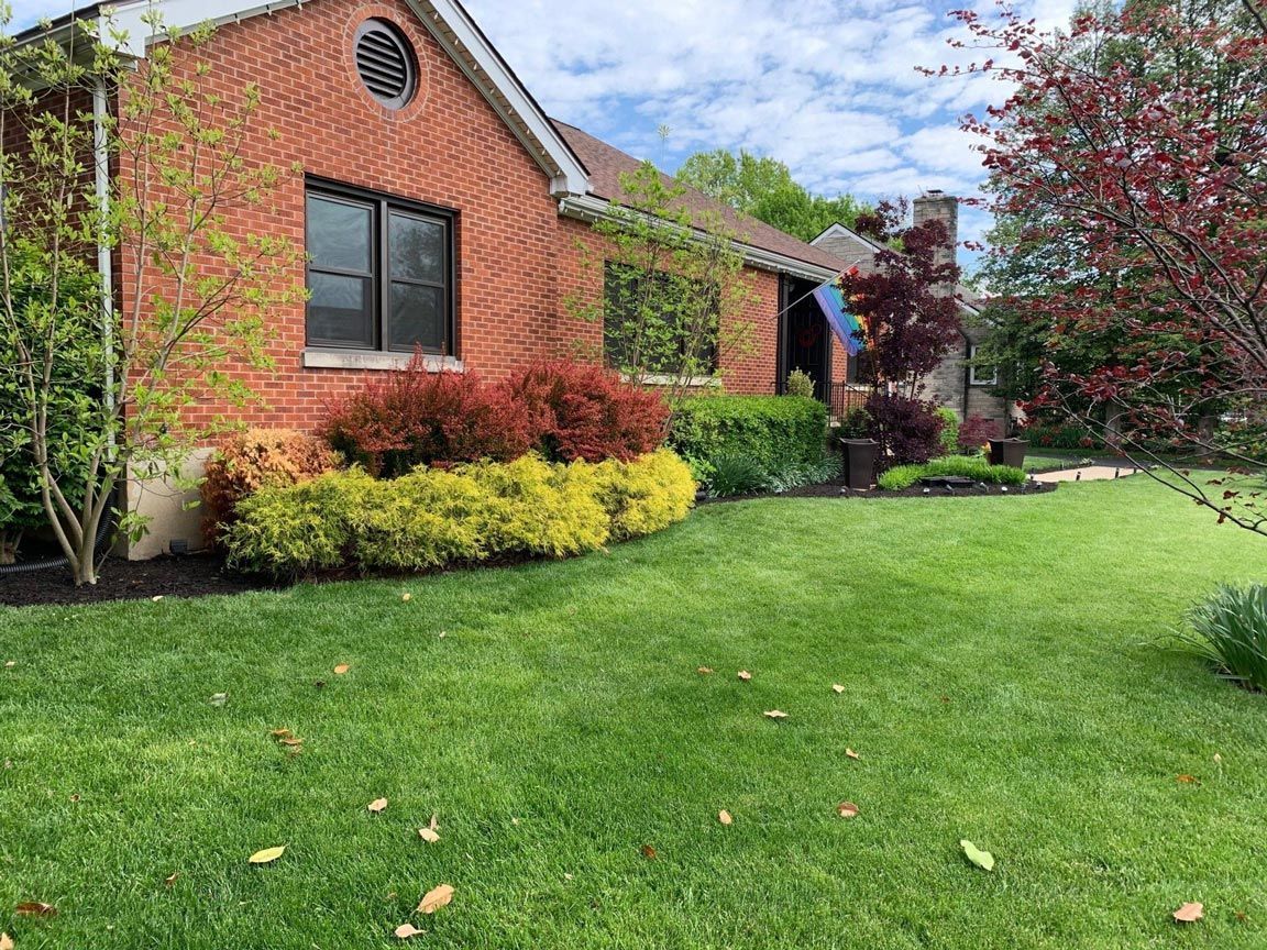 Brick House Lush Green Lawn — Louisville, KY — Titan Landscape Group