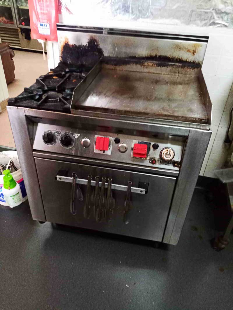 A Stove With a Griddle on Top of It in a Kitchen — Greg Mitchell Plumbing In Murgon, QLD