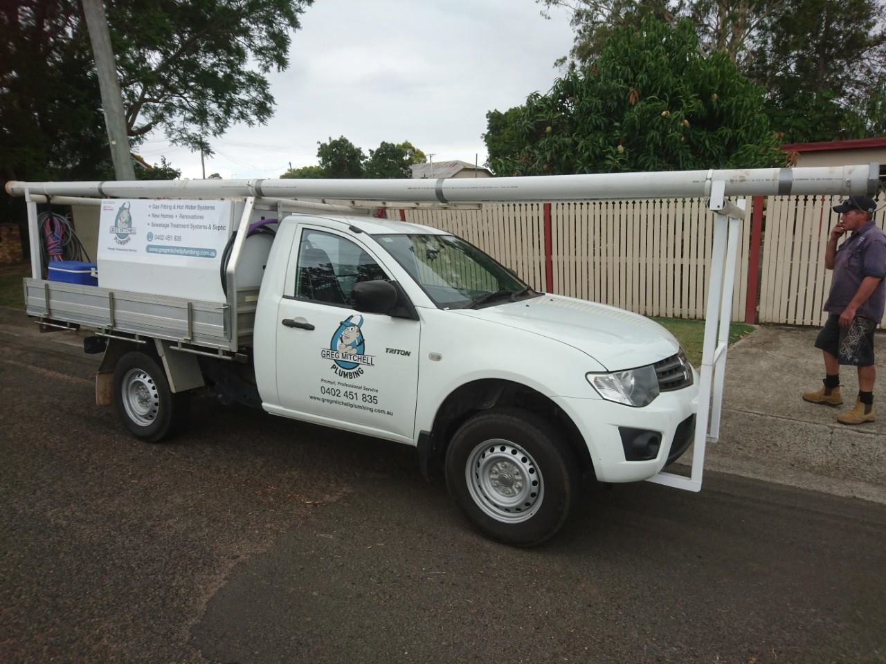A White Truck is Parked on the Side of the Road — Greg Mitchell Plumbing In Murgon, QLD