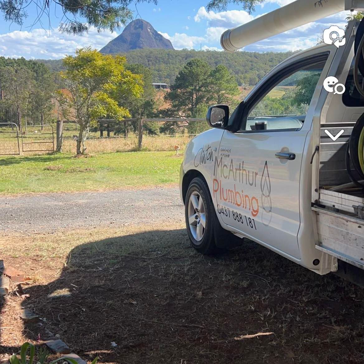A Plumber is Fixing a Sink With a Wrench — Clinton McArthur Plumbing in Landsborough, QLD