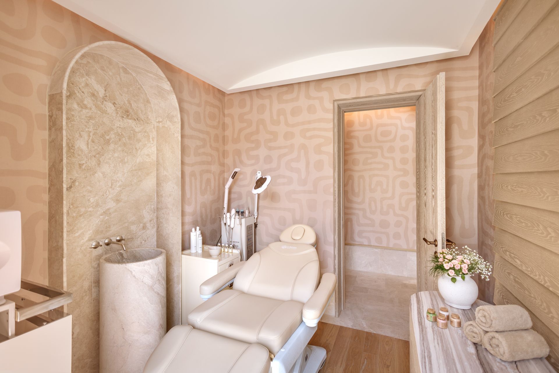 A room with a chair and a sink in it