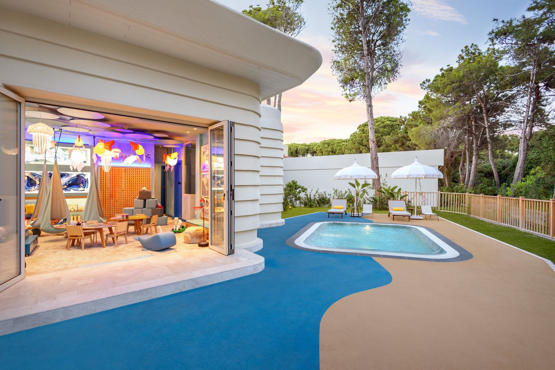 There is a large pool in the backyard of a house.