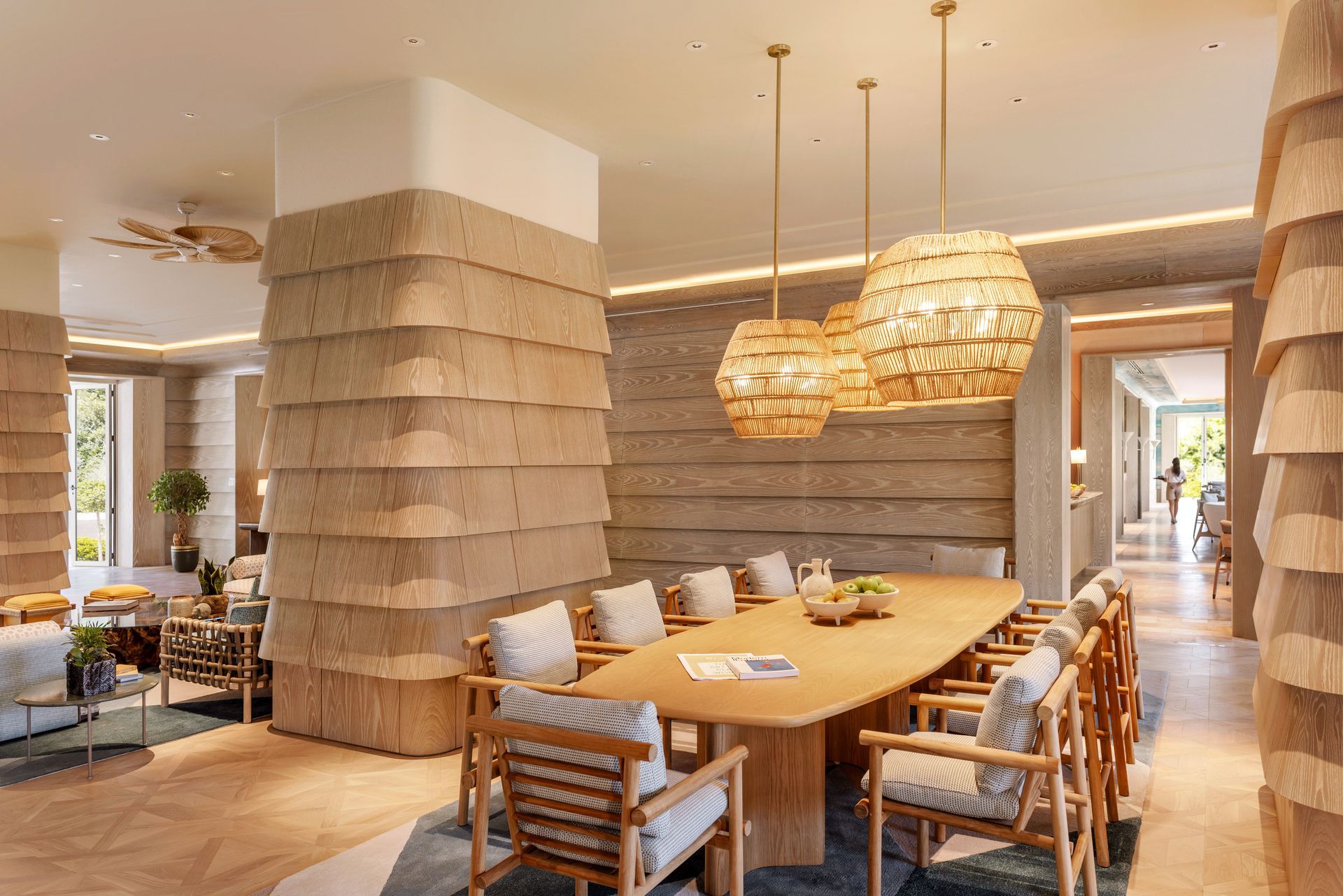 An artist 's impression of a dining room with a long wooden table and chairs.