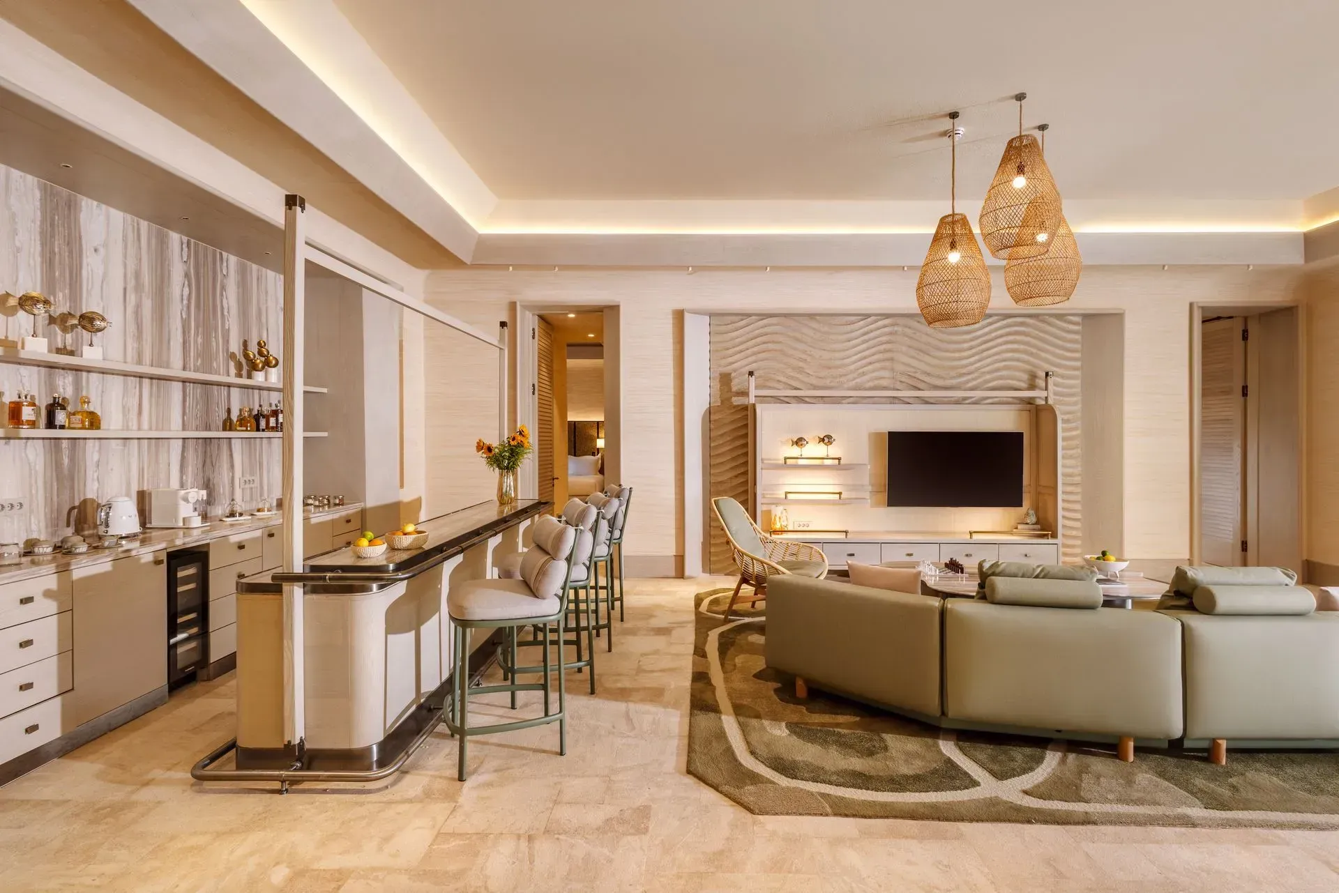 An artist 's impression of a living room with a large couch and a bar.