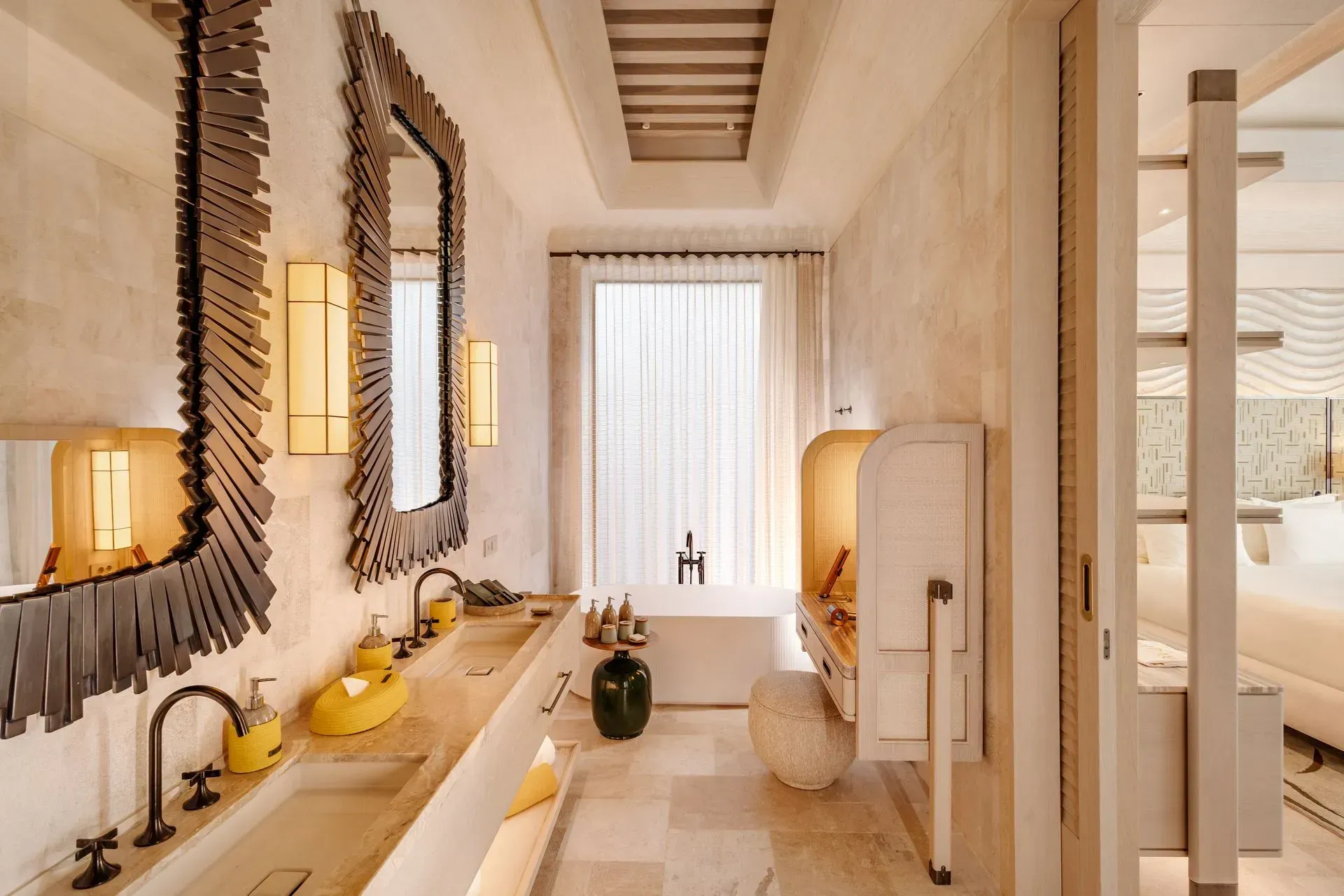 A bathroom with two sinks and two mirrors