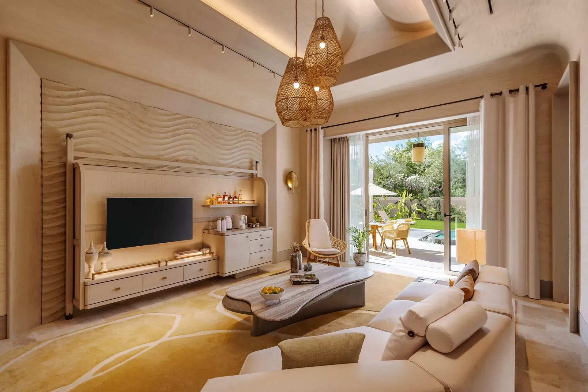 A living room with a couch , chair , table and television.