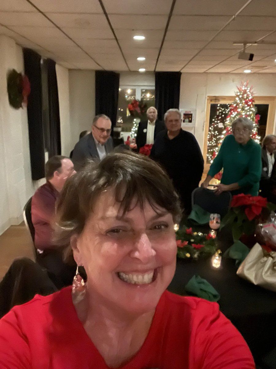 Woman in Red Taking a Selfie with Guests — Columbus, OH — Olentangy Pediatrics Inc
