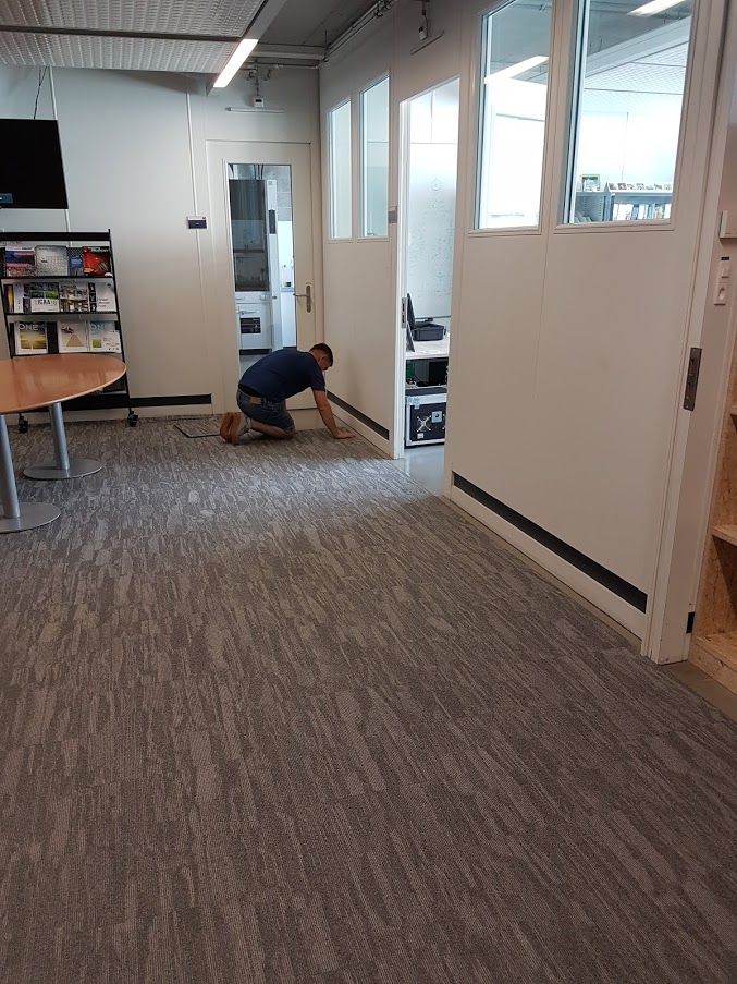 Pose de tapis en dalles