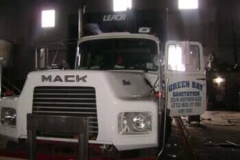 White truck in the garage — Green Bay Sanitation in Little Neck, NY