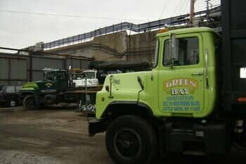 Green truck — Sanitation Service in Little Neck, NY
