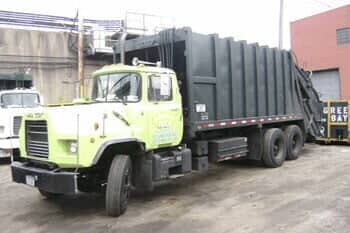 Green truck detail — Dumpster rental Queens NY in Little Neck, NY