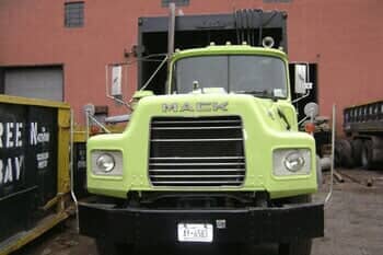 Green truck front view  — Dumpster Rental Brooklyn NY in Little Neck, NY