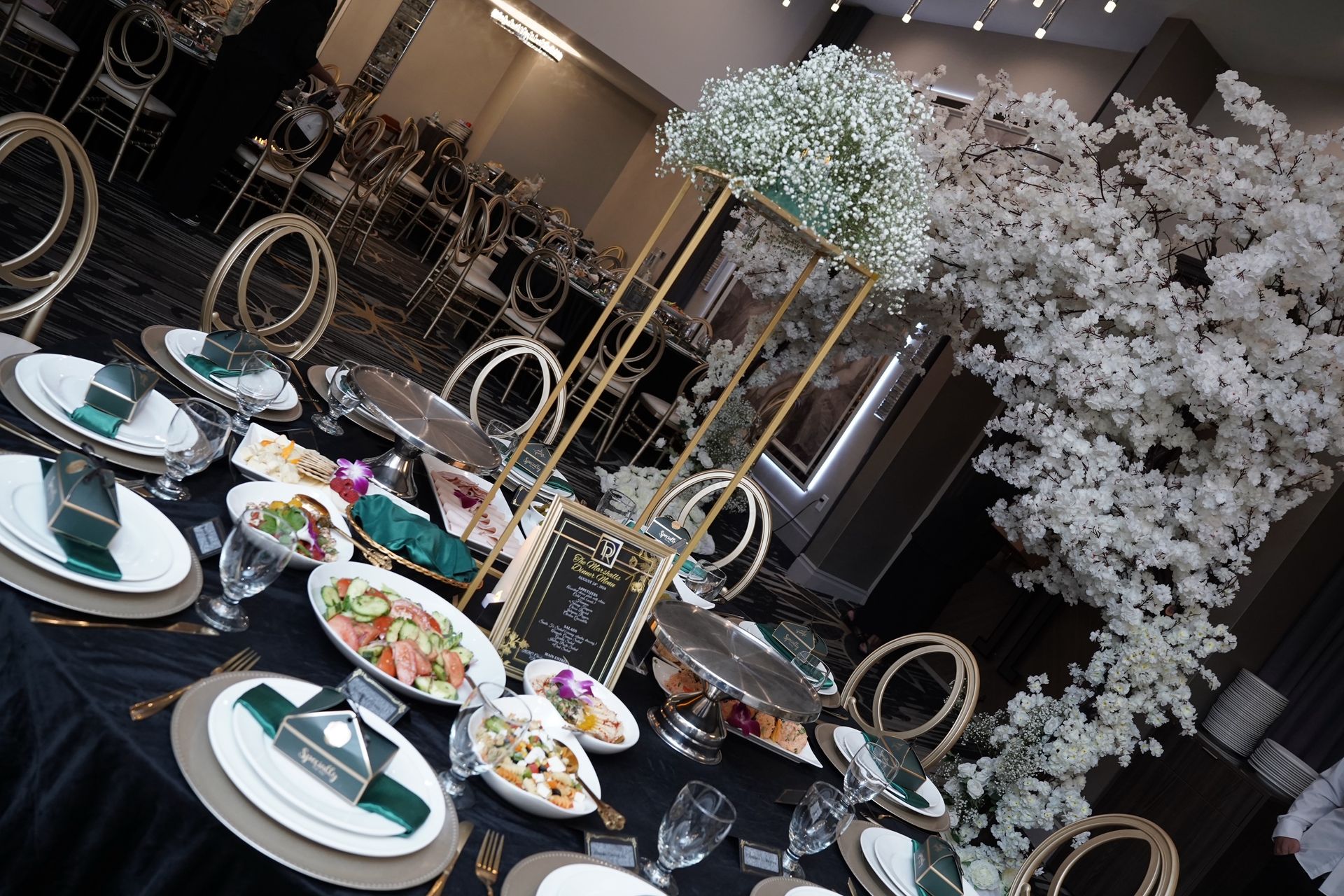 Elegant table setting with floral centerpiece and place settings for a catered event.