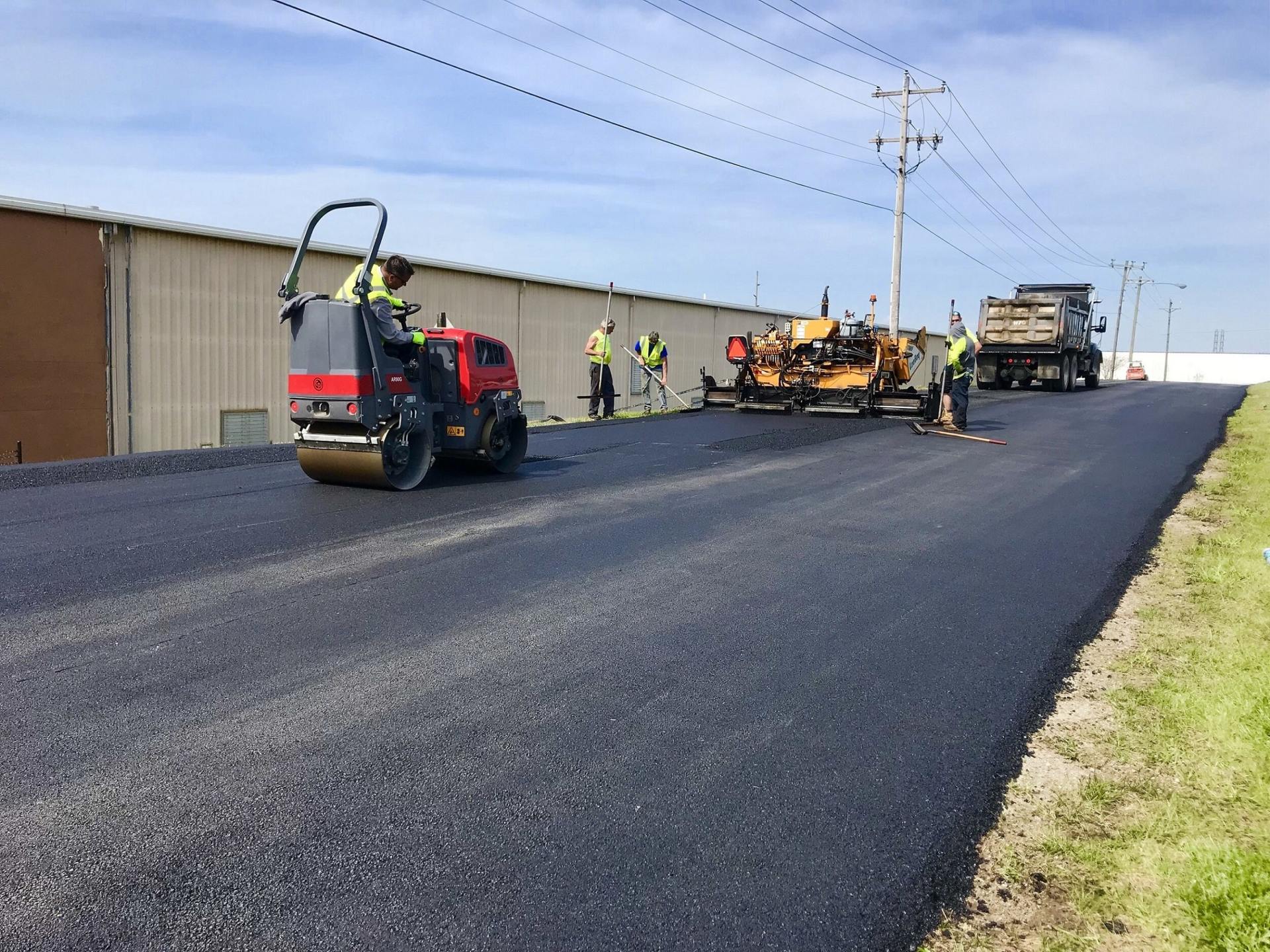Men Asphalt Paving With Road Roller — Chatanooga, TN — Pro-Seal & Paving LLC