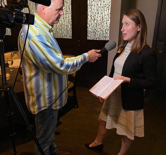 internal communications consultant conducting a video interview during a crisis communications workshop