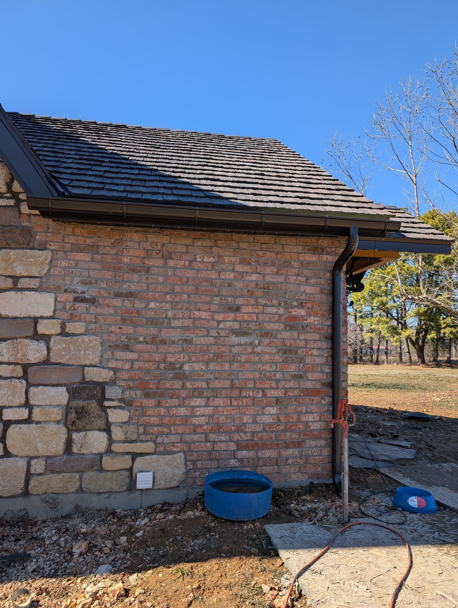 A home's new gutter and downspout