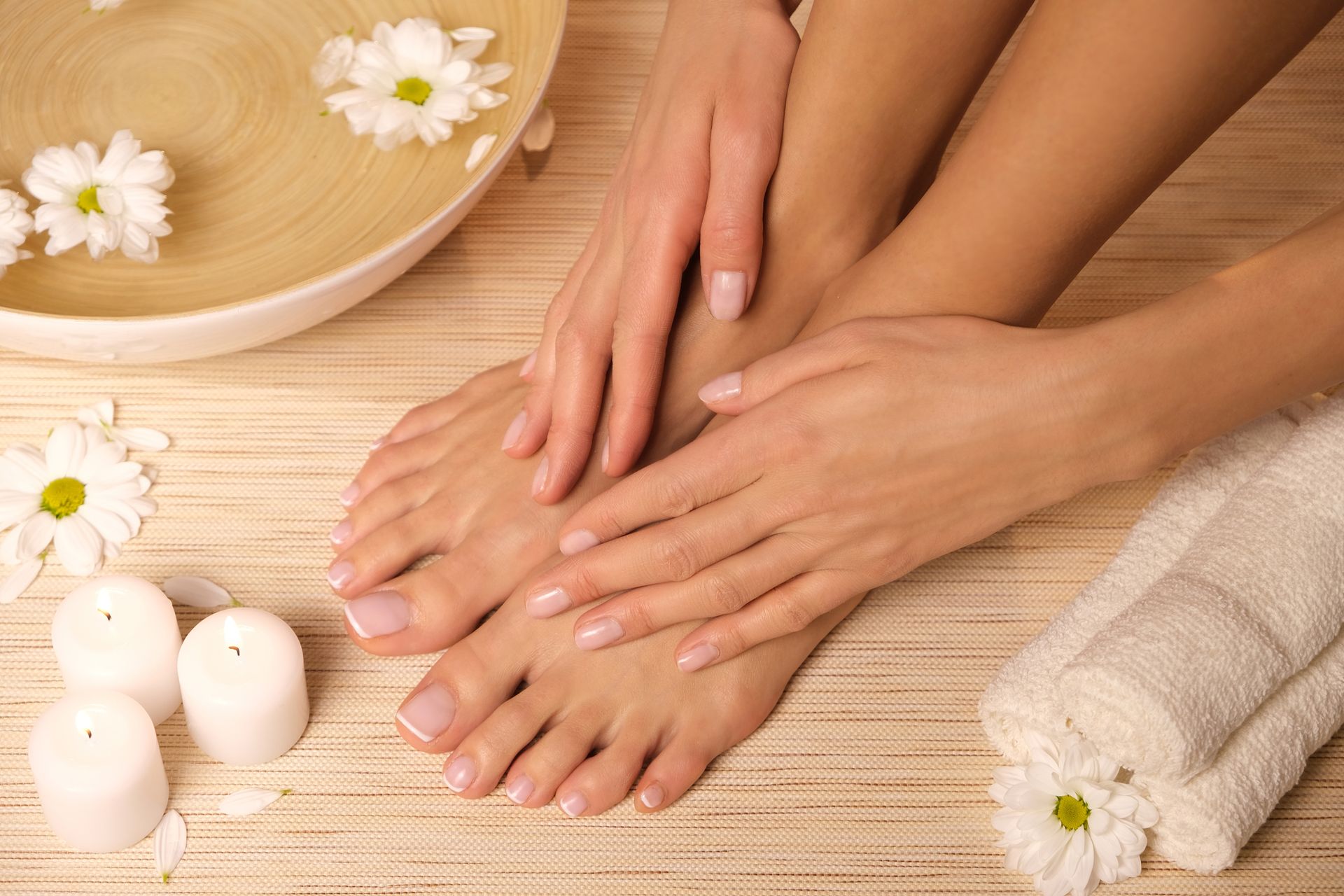 A woman is getting a foot massage in a spa.