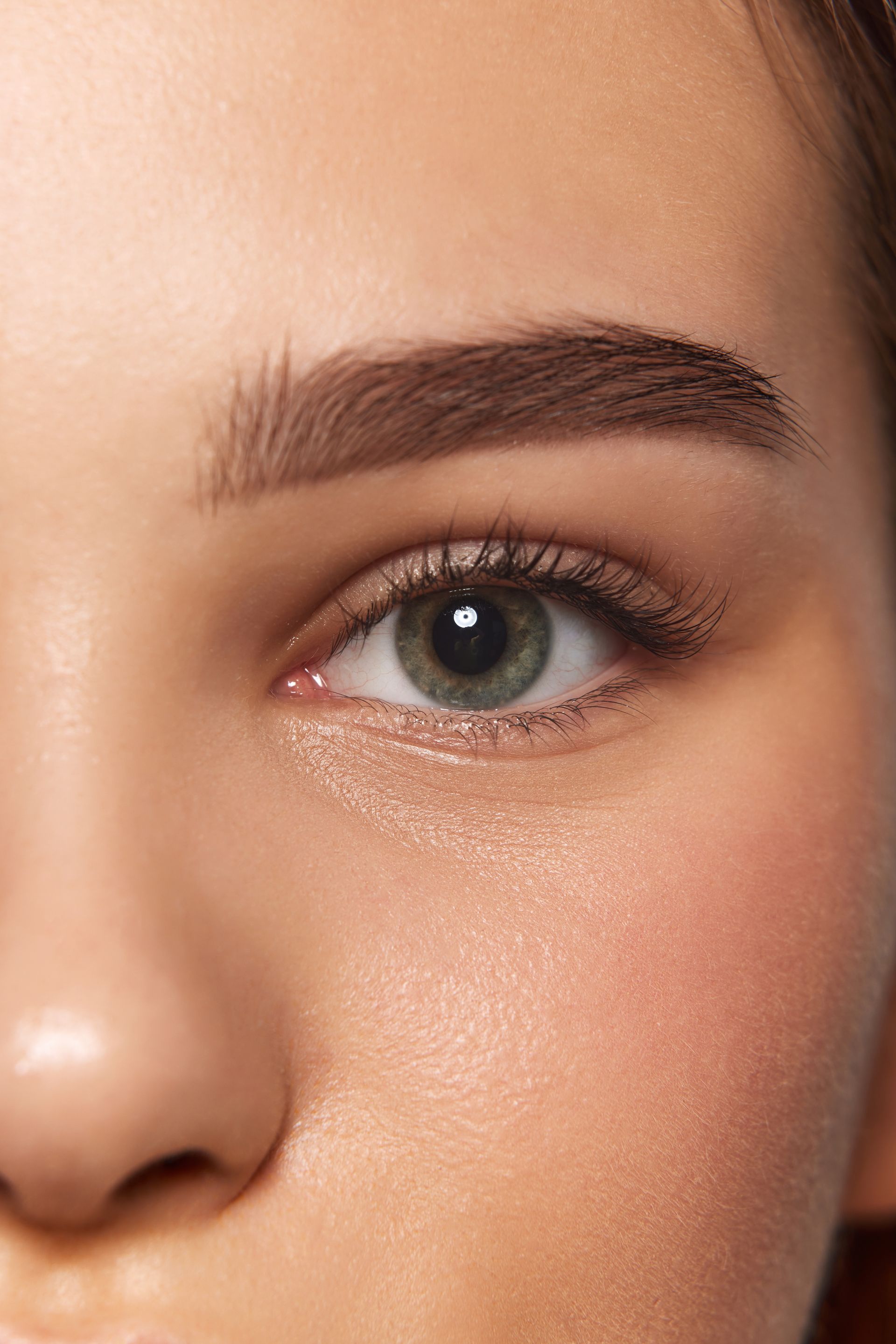 A close up of a woman 's eye with makeup on.