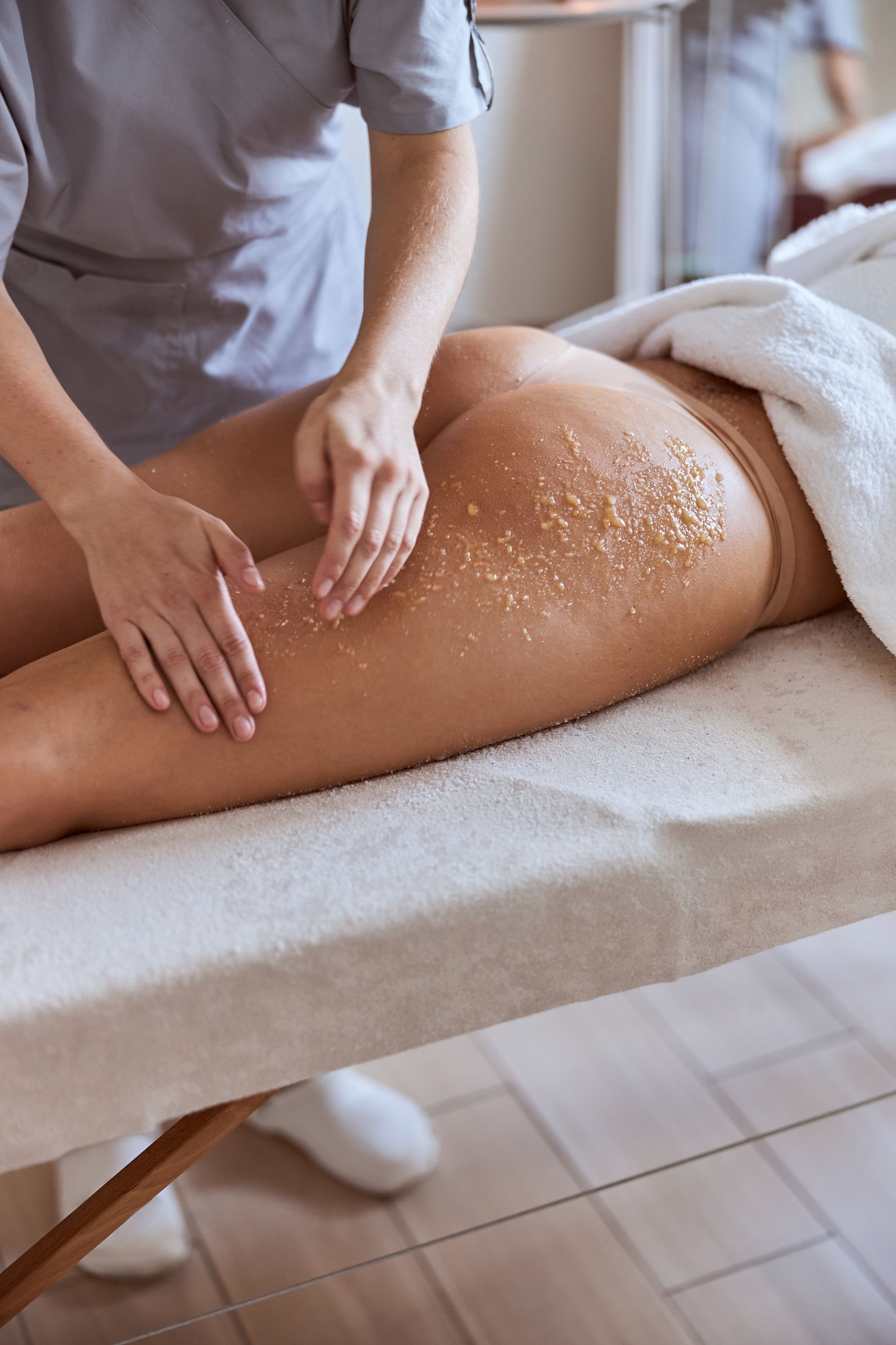 A woman is getting a massage in a spa.