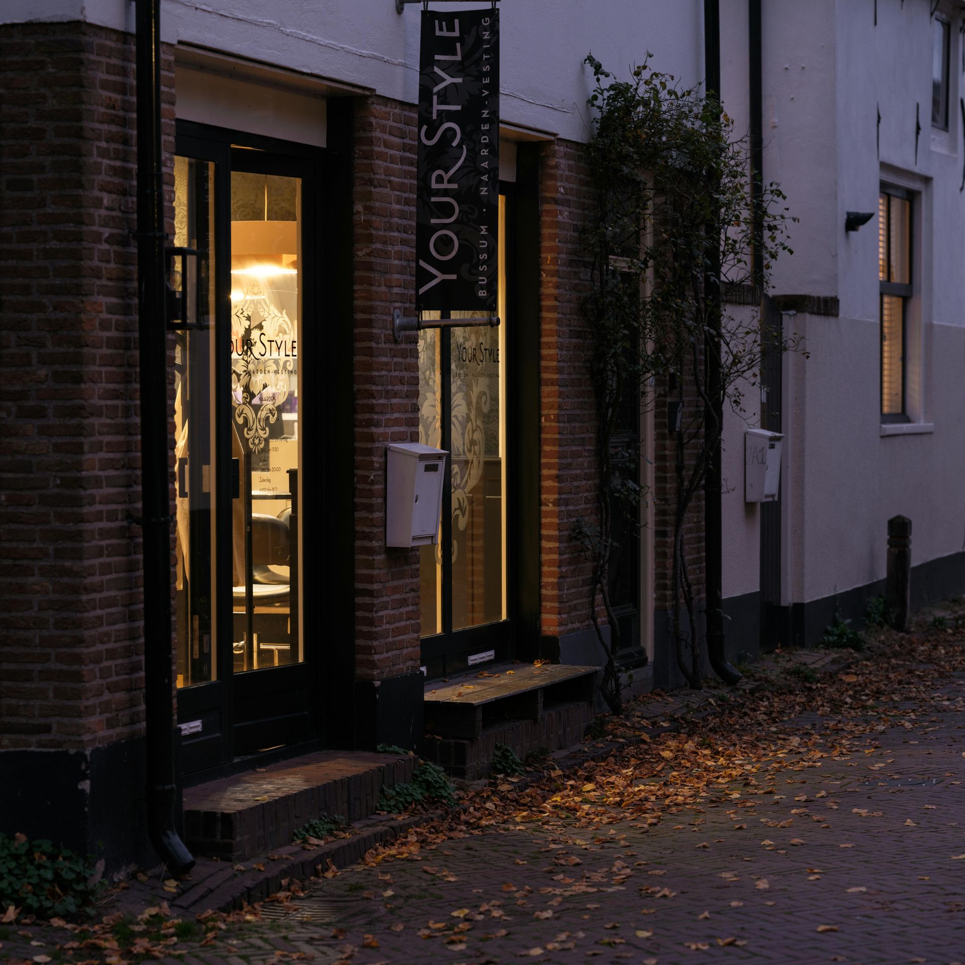 Shopfront, brick and white building exterior, 