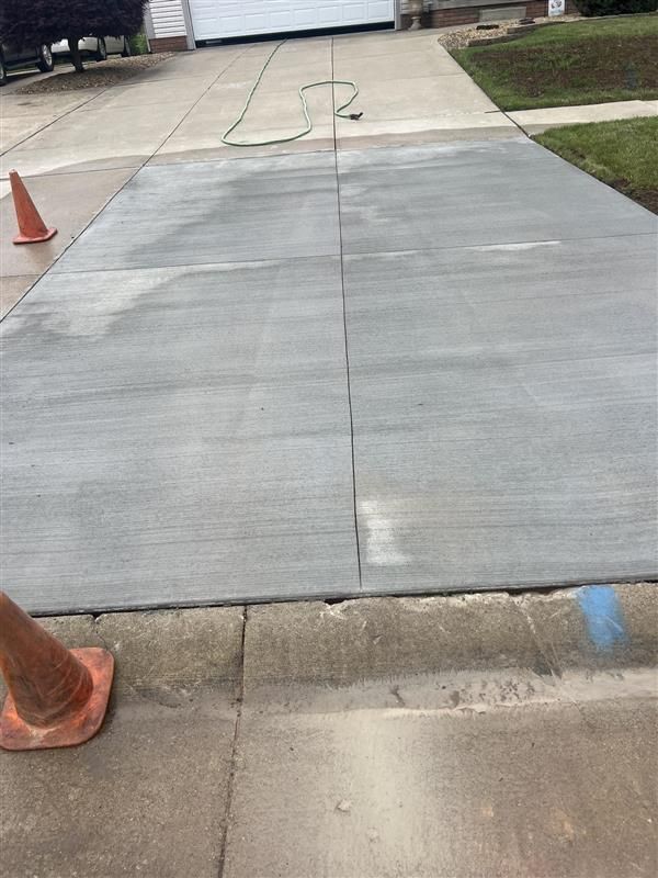 An empty room with stairs and a white wall.