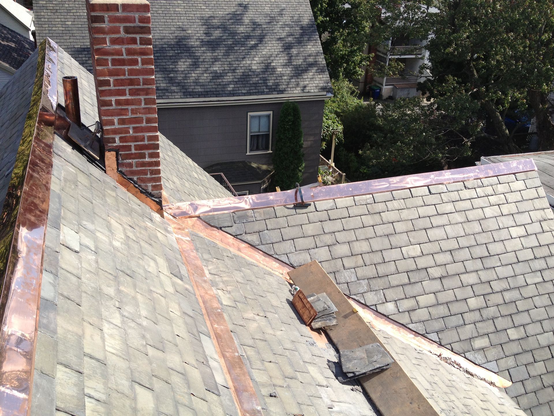 A roof with a brick chimney on it
