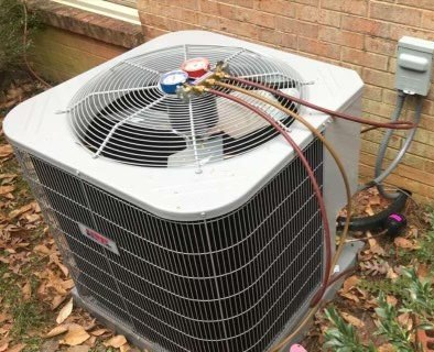 Feet on a Heating Radiator — Danville, VA — KC Plumbing, Heating & A/C