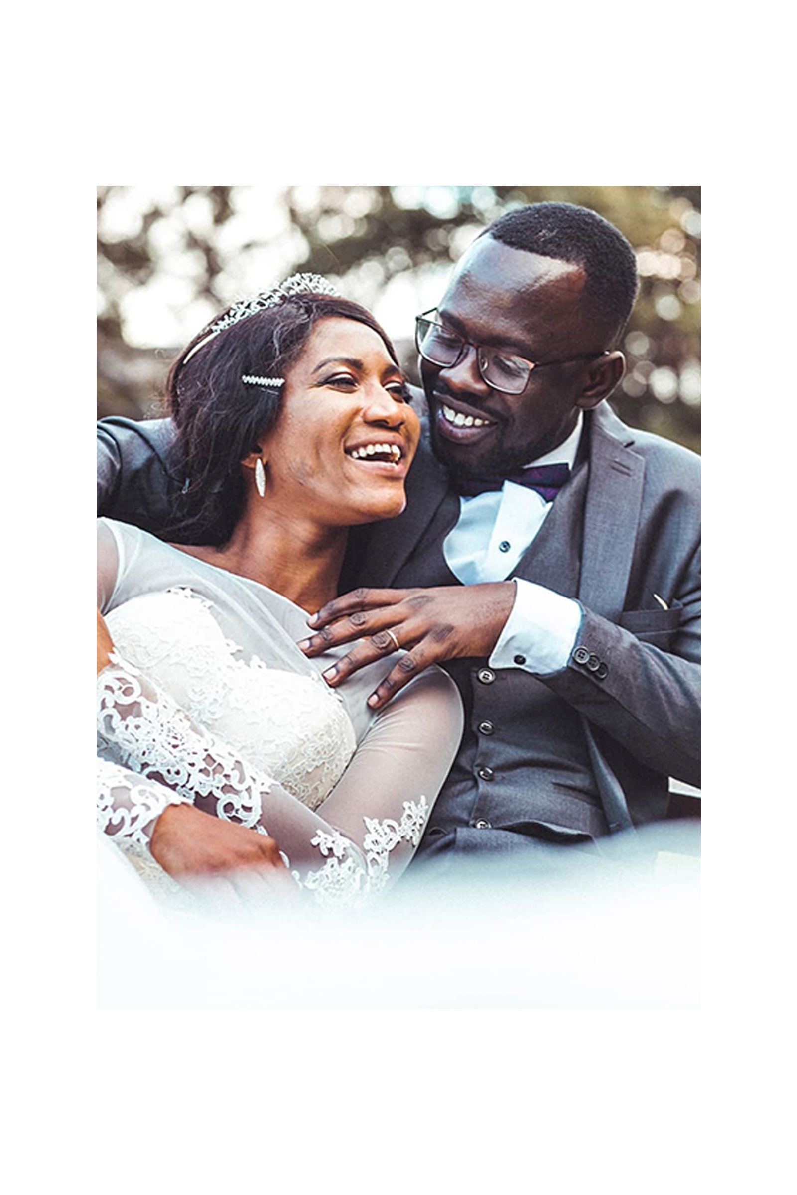 A bride and groom are posing for a picture on their wedding day.