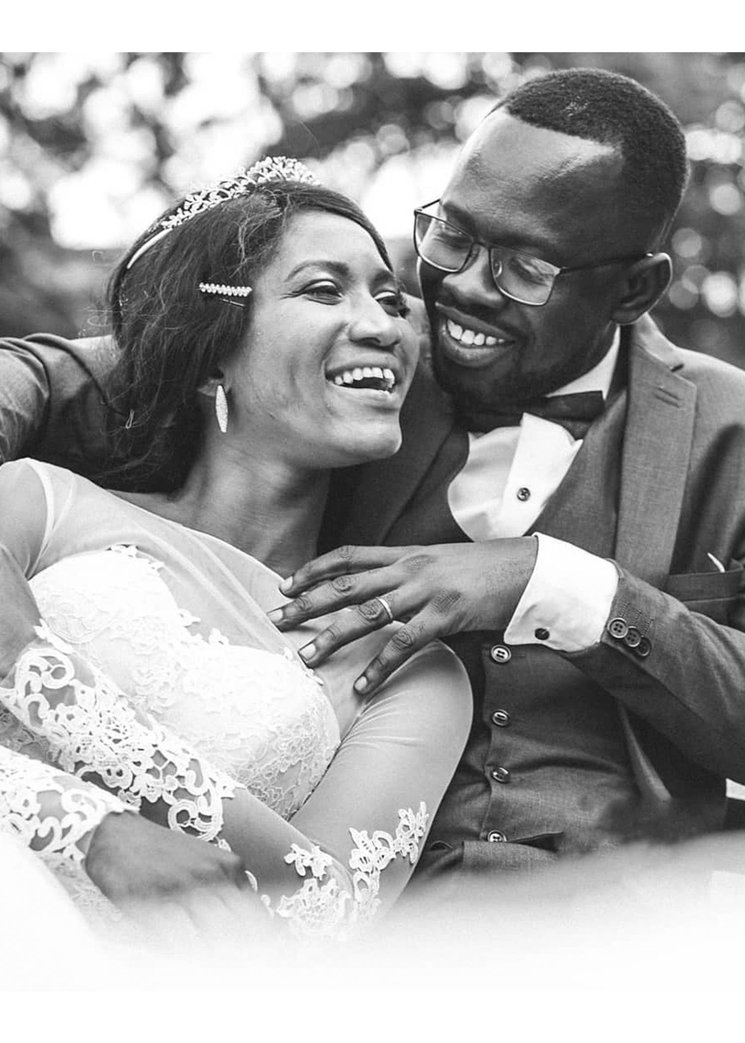 A black and white photo of a bride and groom on their wedding day.