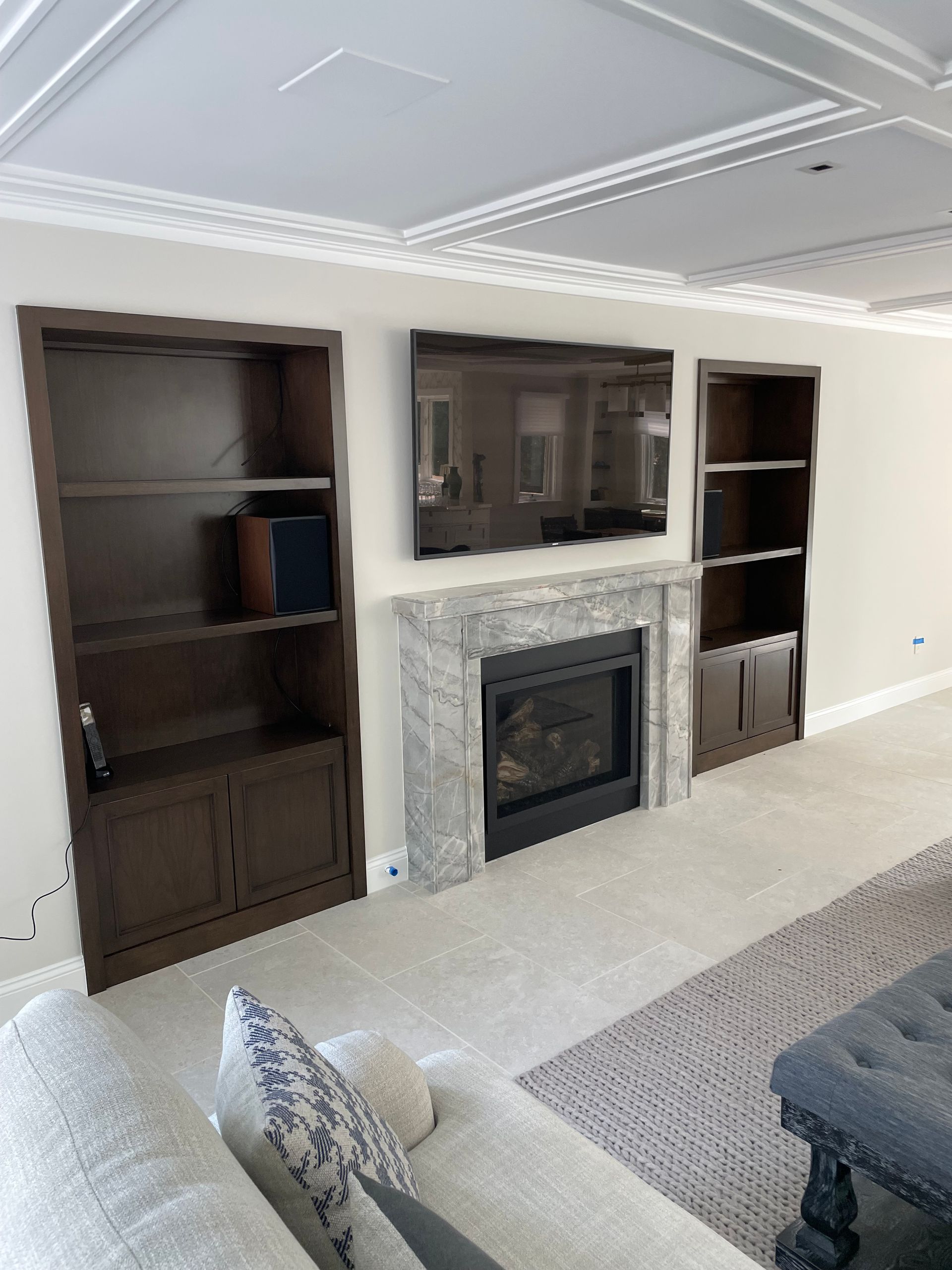 A living room with a fireplace and a couch