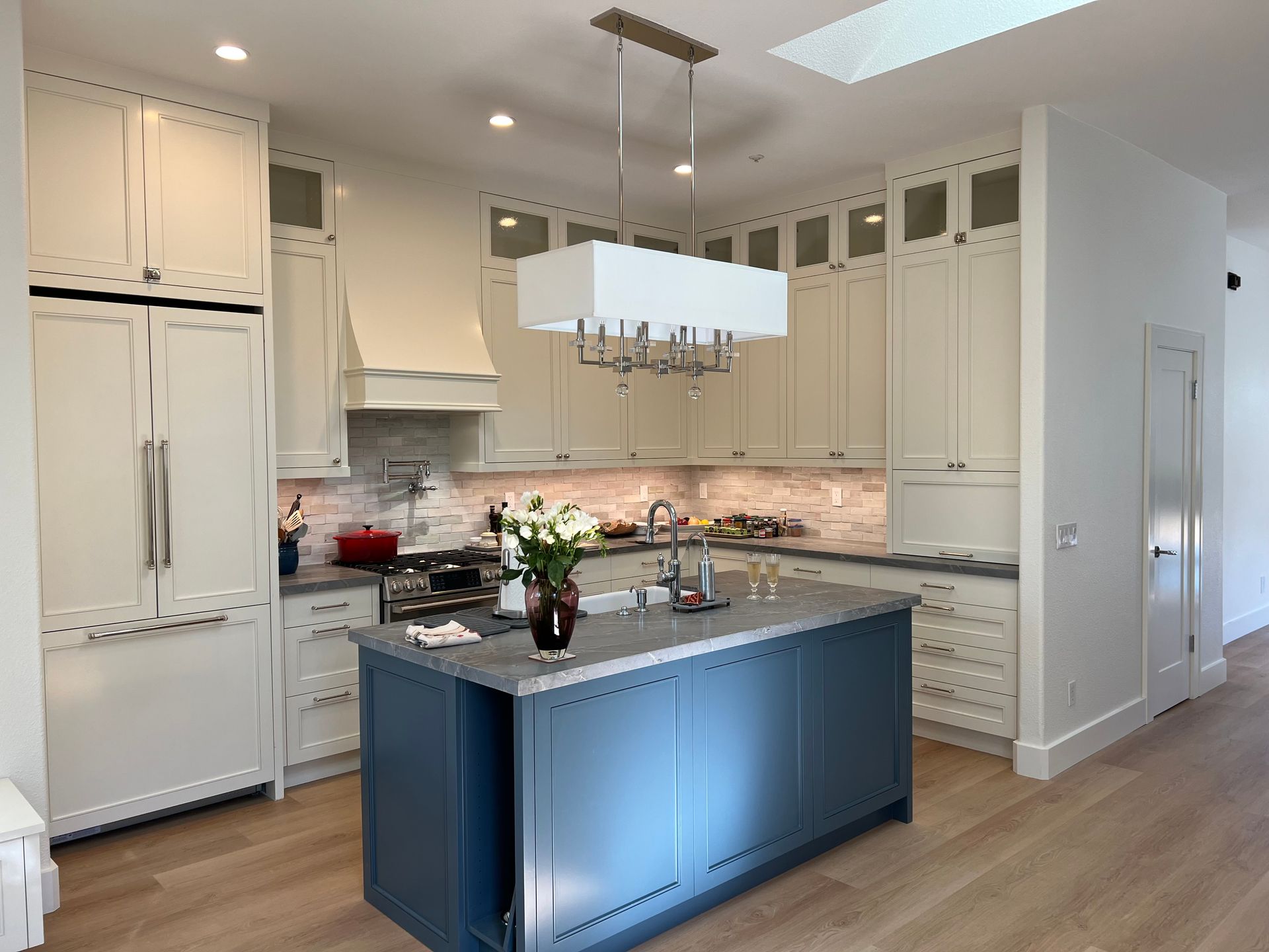 There is a large island in the middle of the kitchen.