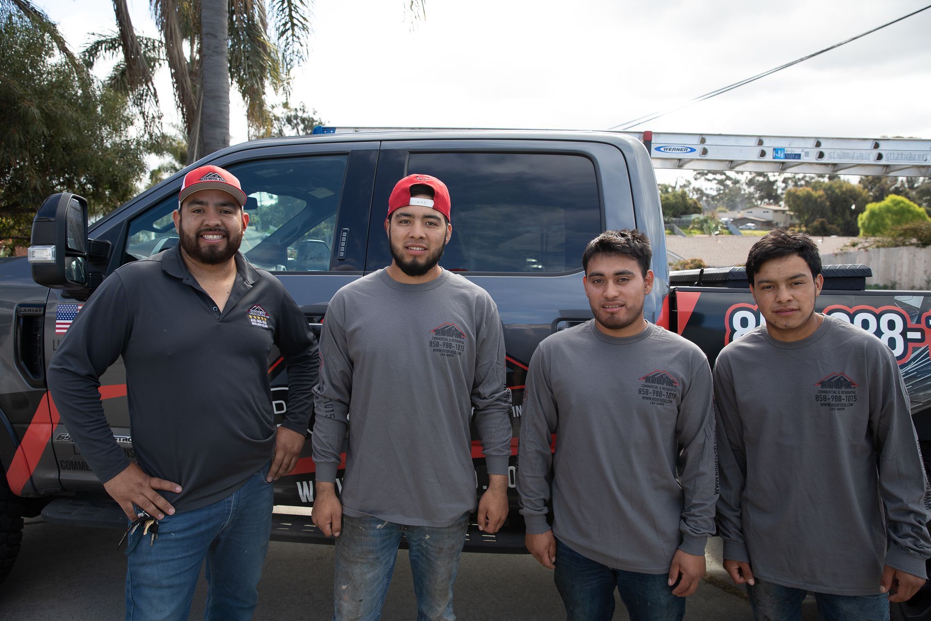 A group of men standing in front of a truck that says ' o'neill ' on it