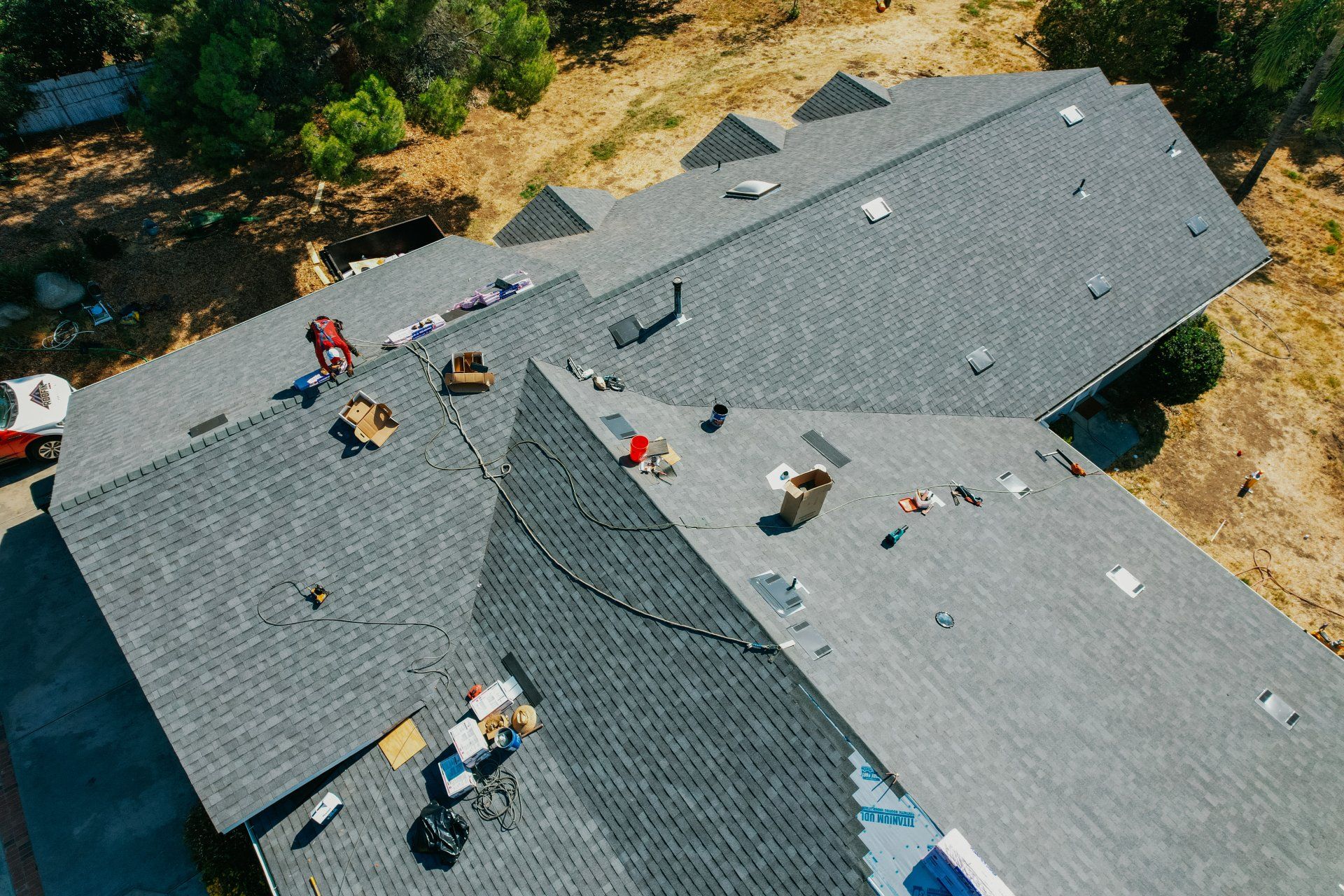 An aerial view of a house with a roof in progress