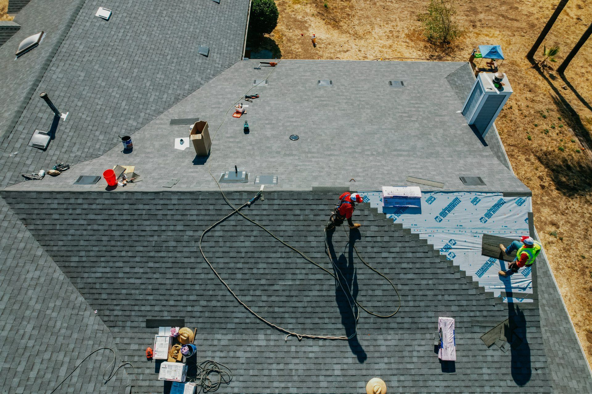 An aerial view of a roof being worked on