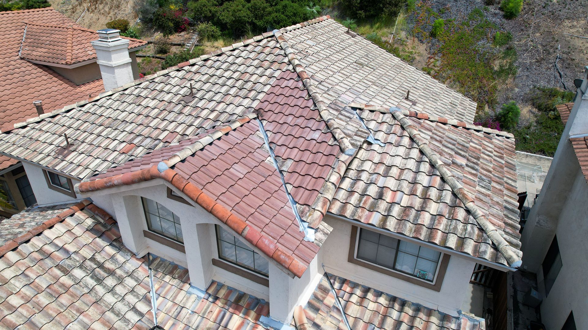 An aerial view of a house with a tiled roof