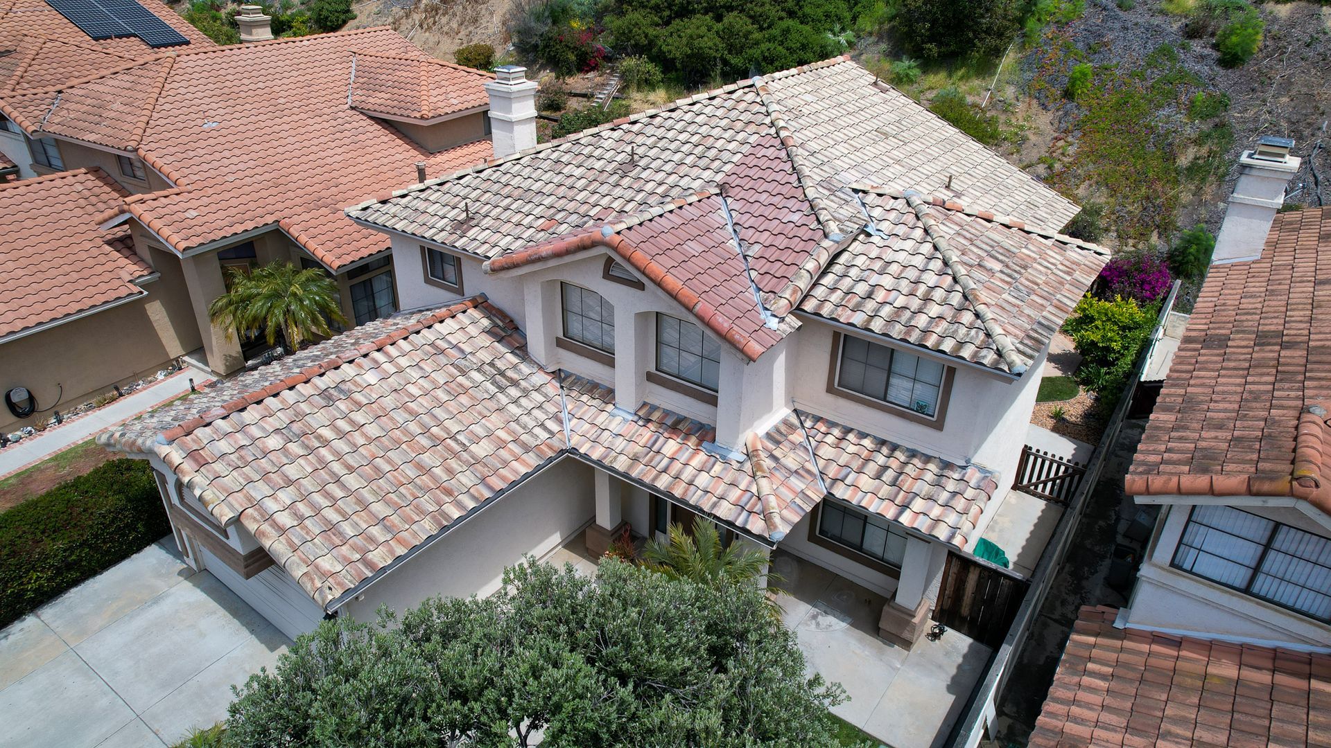 An aerial view of a house with a tiled roof