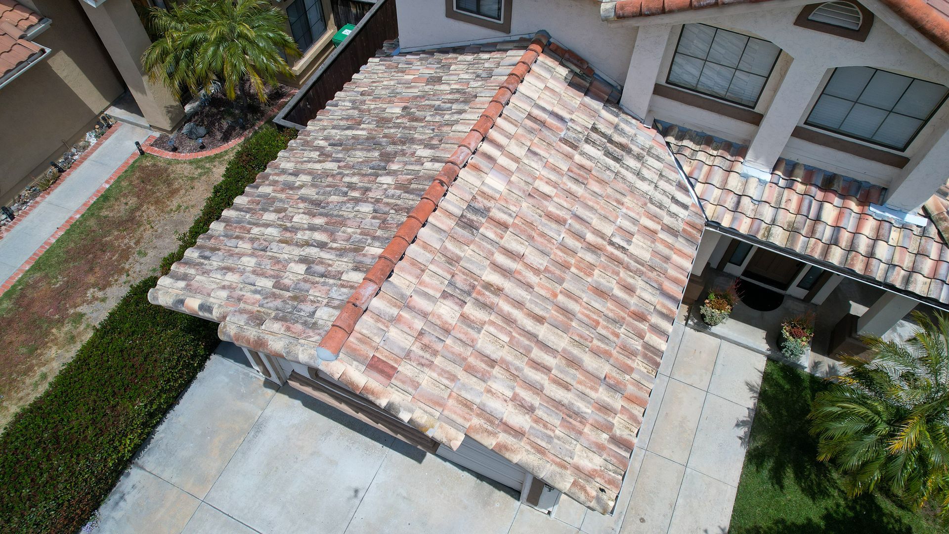 An aerial view of a house with a tiled roof