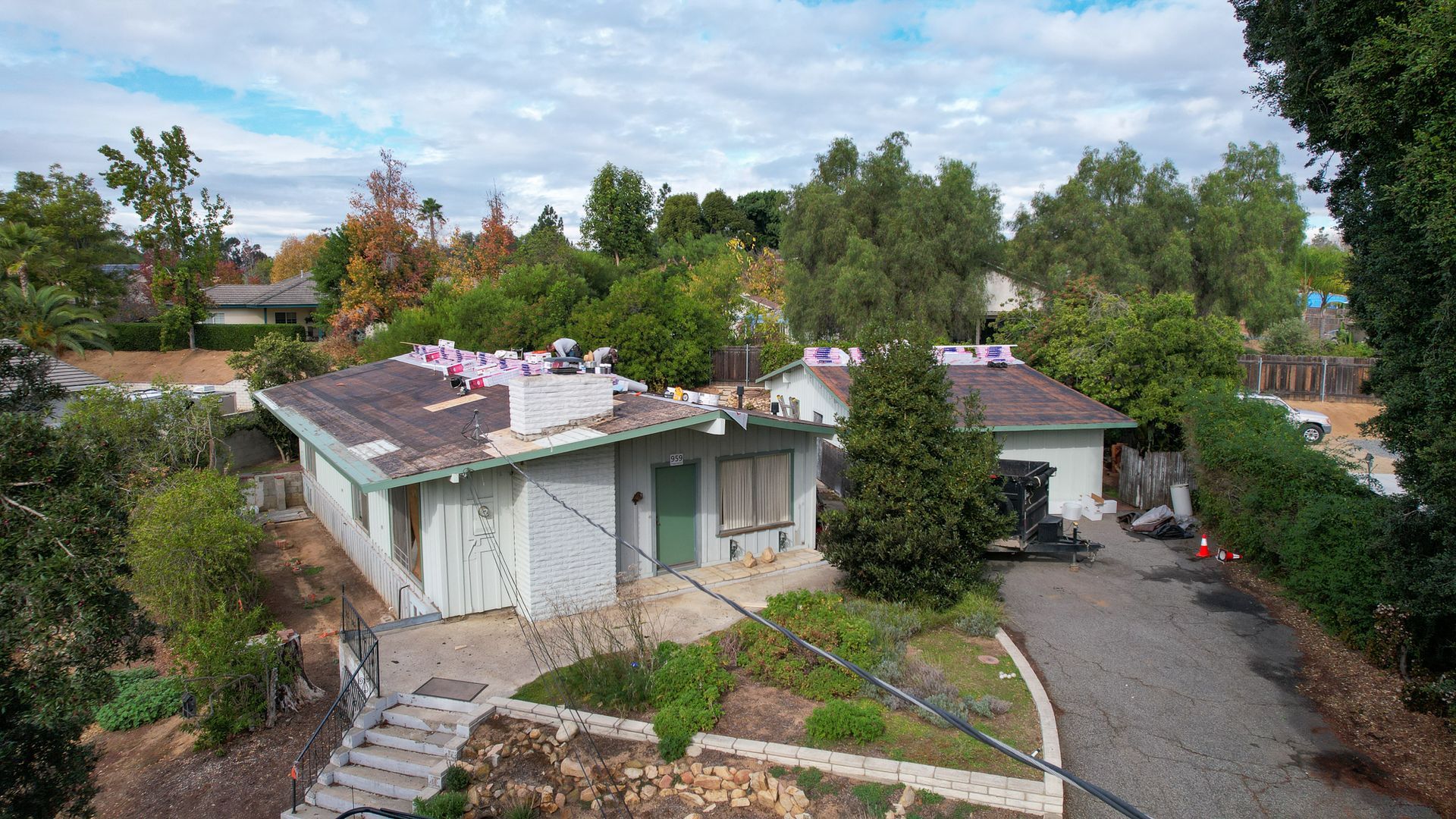 An aerial view of a house that is being remodeled